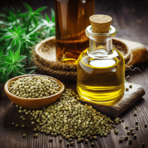 hemp seed oil in a bottle and hemp seeds in a wooden saucer