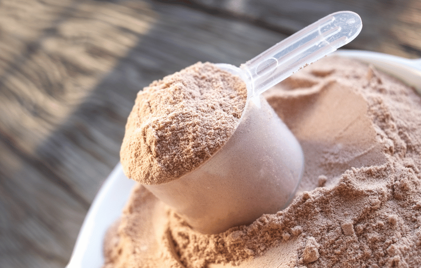 Scoop of chocolate flavor protein powder