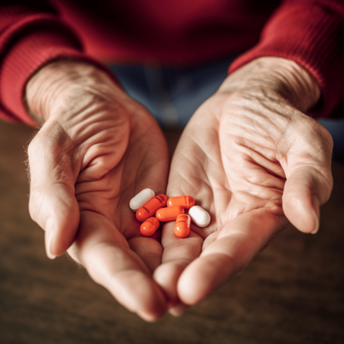 Close up of senior hands with a medicines