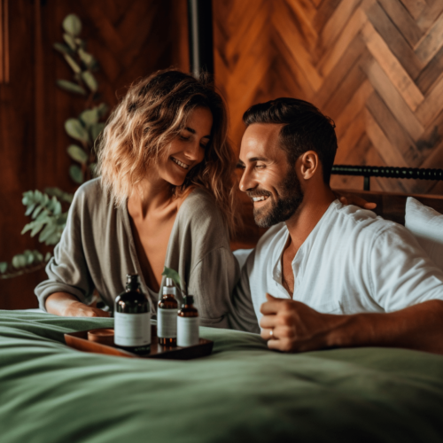 couple sitting in bed with hemp seed oil in front of them