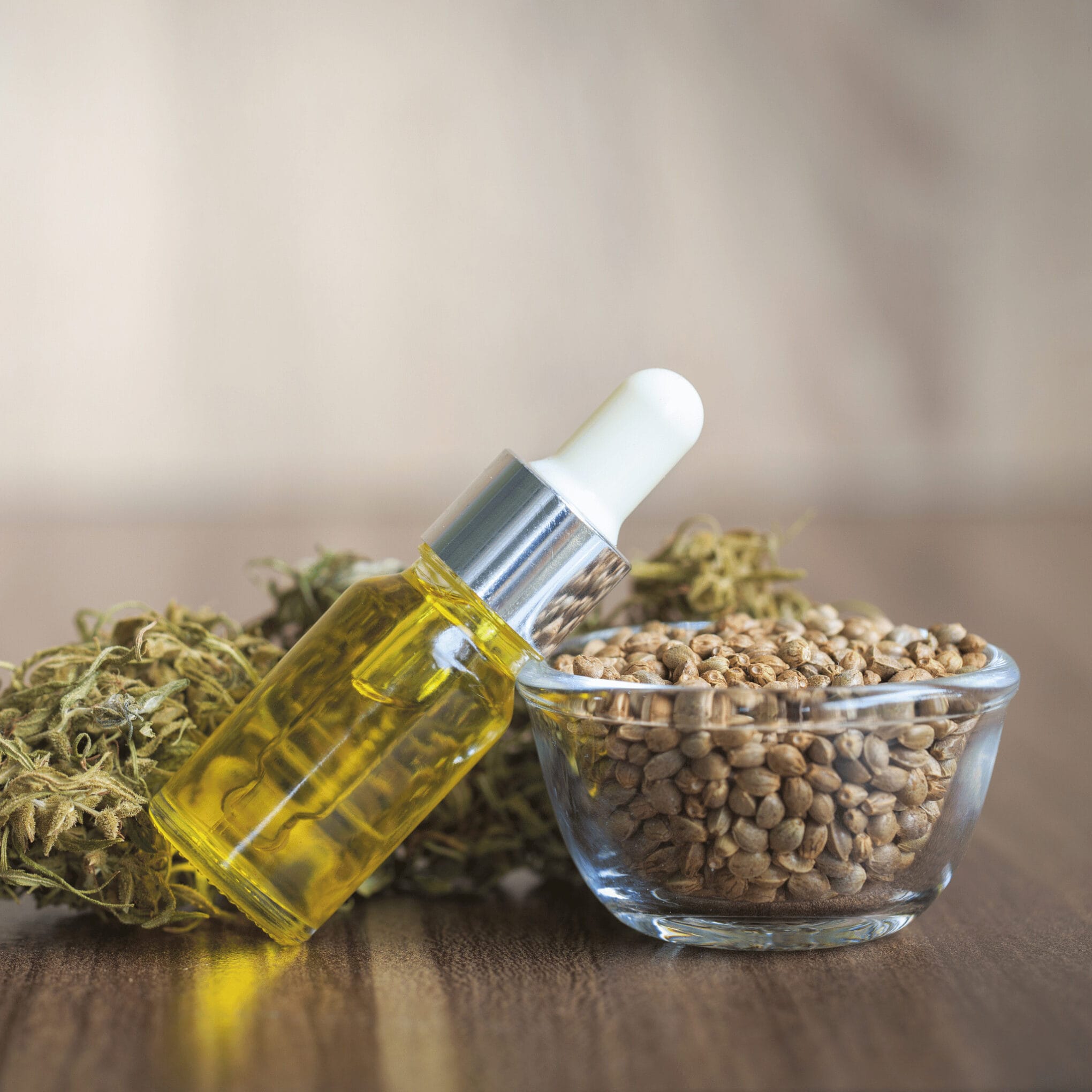 Hemp oil in the bottle and hemp seeds