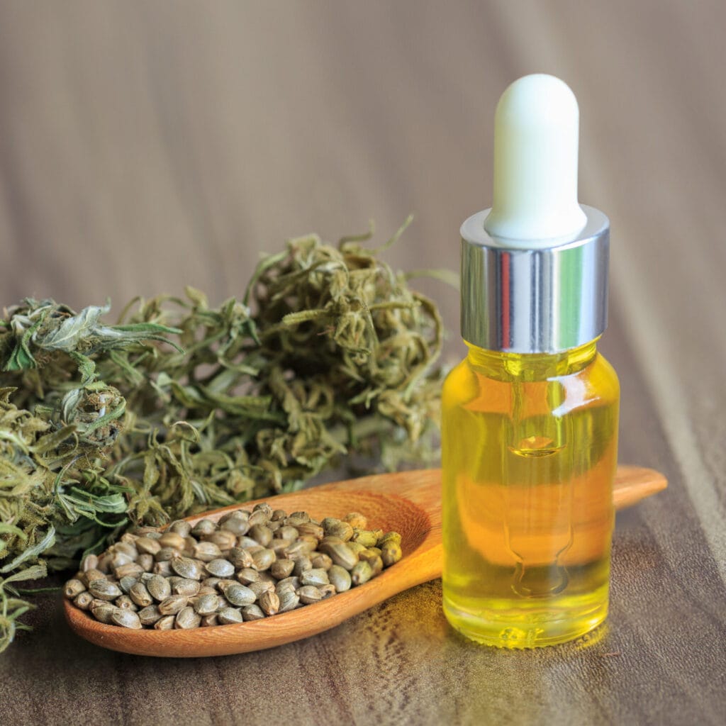 Hemp oil in the bottle and hemp seeds