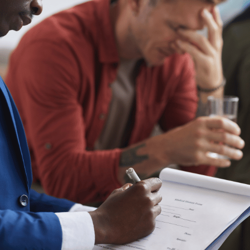 man crying in cognitive behavioral therapy session