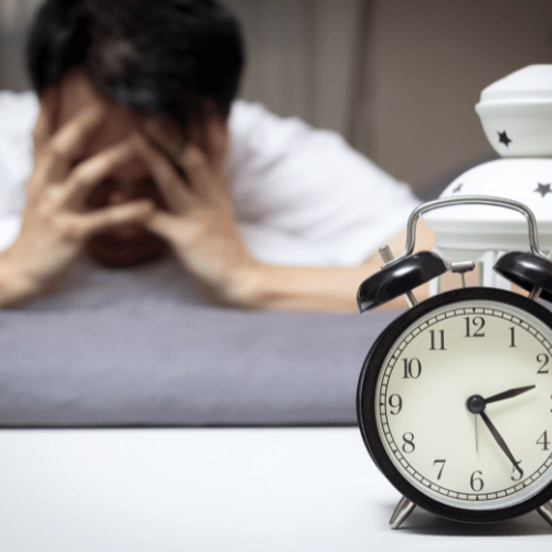 man in bed suffering insomnia and sleep disorder